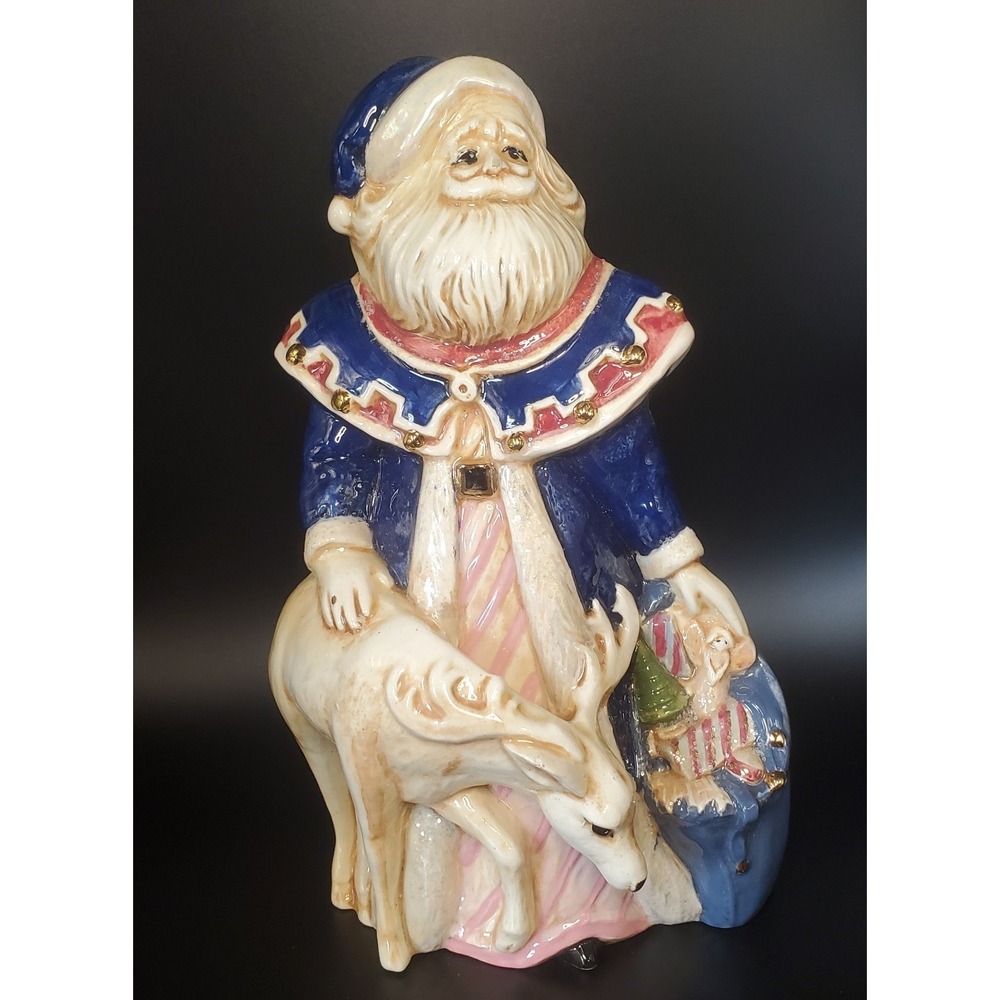 10 & 1/2" X 5 & 3/4" Ceramic Santa Figurine. Santa And White Stag